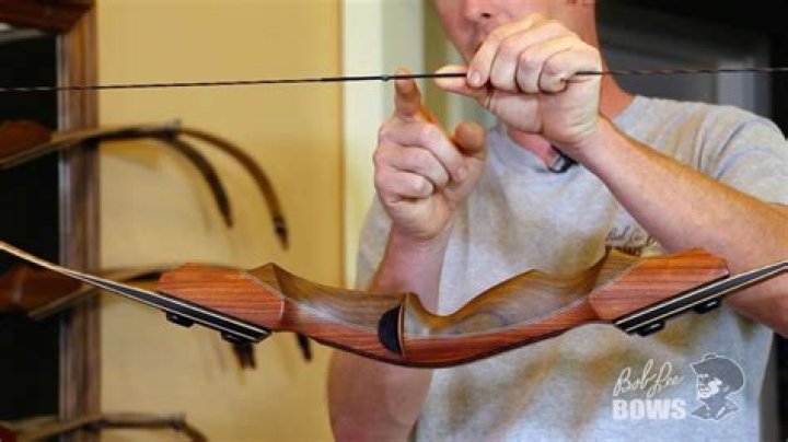 How do you nock an arrow on a recurve bow?