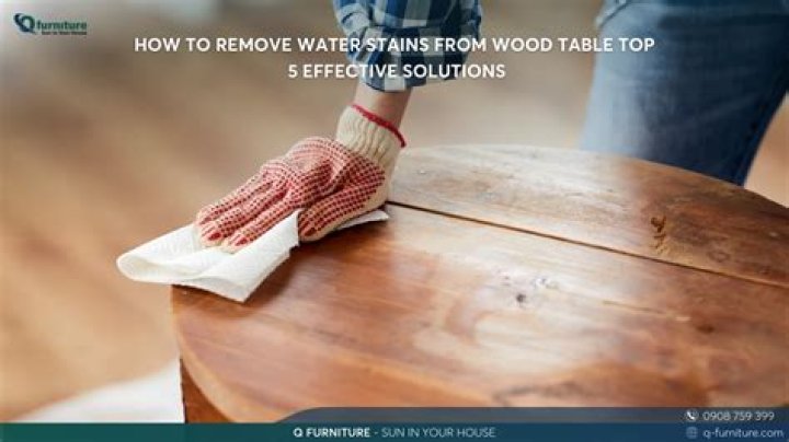 How do you remove black water stains from wood table top?