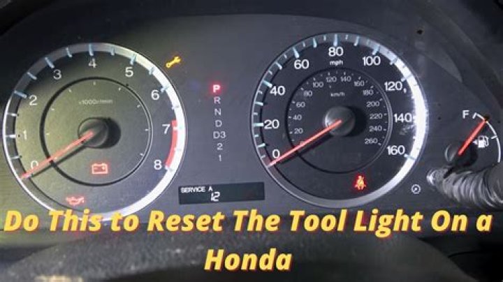 How do you turn off the maintenance required light on a 2003 Honda Odyssey?