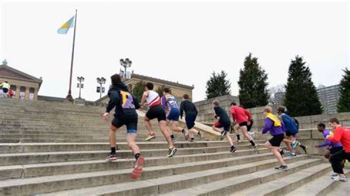 What song is playing when Rocky runs up the stairs?